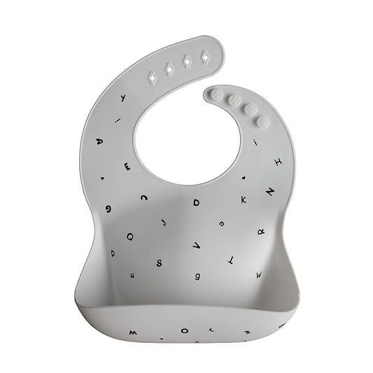 mushie Silicone Baby Bib | Adjustable Fit Waterproof Bibs (Letters White)