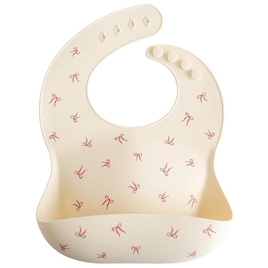 mushie Silicone Baby Bib | Adjustable Fit Waterproof Bibs (Bows)